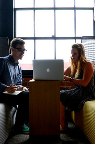 Two people sitting together talking