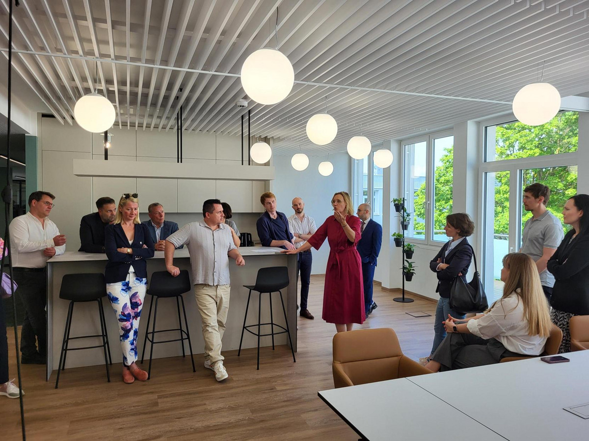Our group touring a brand-new office space and discussing the challenges of ensuring collaboration and communication between teams.