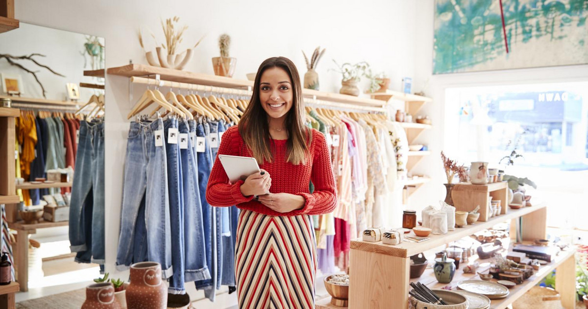 An entrepreneur with an MBA in marketing is standing in her store