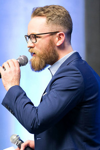 Man speaking into a microphone