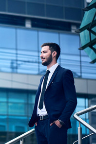 A man standing in front of a building