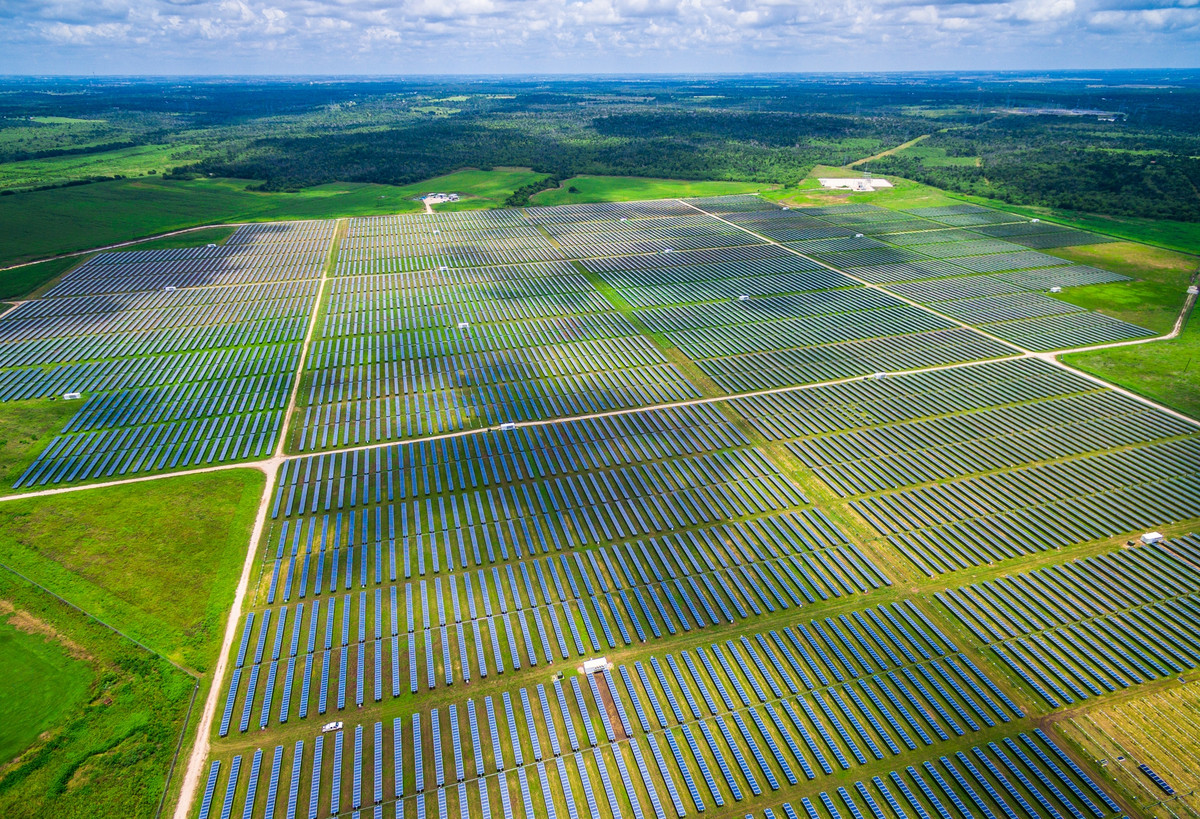 An aerial view of a huge solar installation spreading over multiple miles