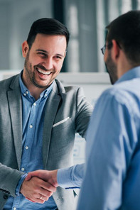 MBA students shaking hands