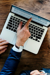 A man is pointing on a computer screen