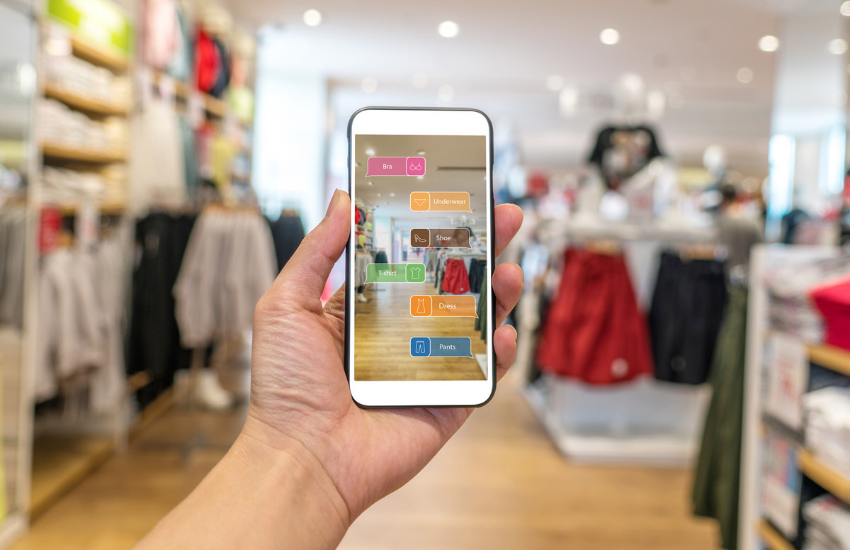 A mobile phone showing an augmented reality application in a store