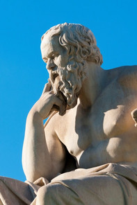 a marble statue of a thinking man