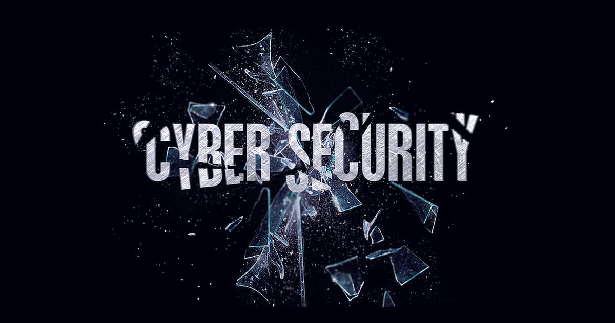 The word Cyber Security is written on a piece of glass that is shattering