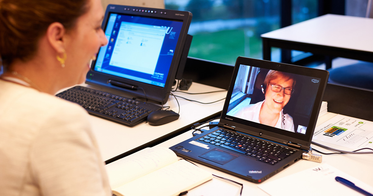 A video conference on a laptop