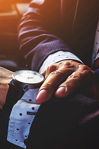 A man looking at his watch