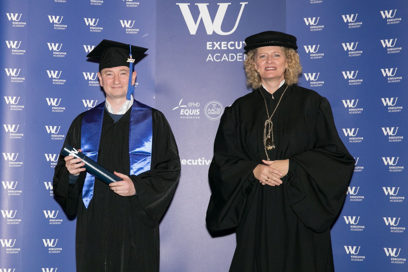 Yury at his MBA graduation with WU Executive Academy Dean Barbara Stöttinger