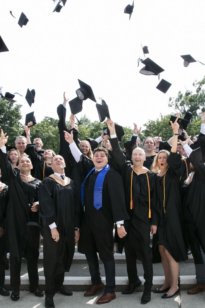 Graduates throwing their caps